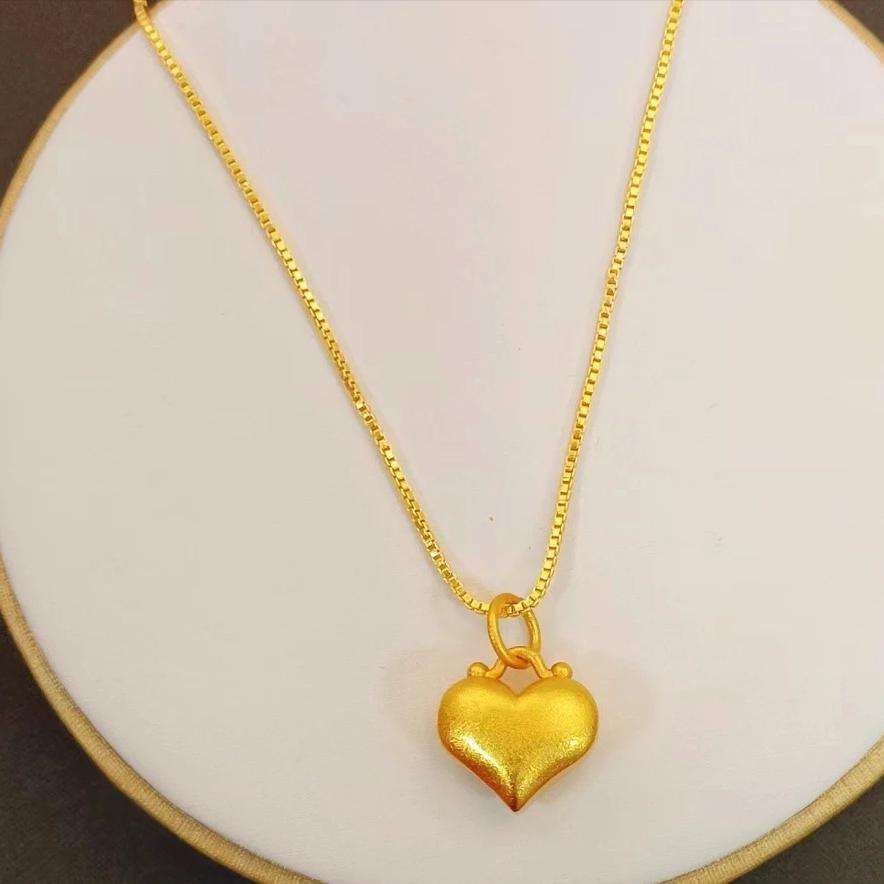 Gold plated heart pendant necklace with double heart design in brass