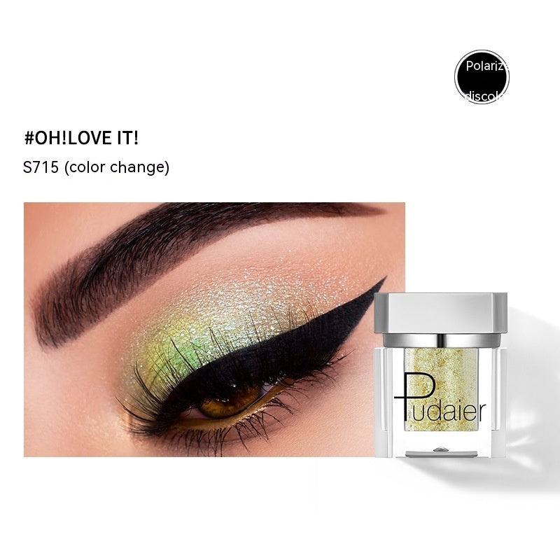Eye makeup with green and gold color change effect and Pudaier product packaging.