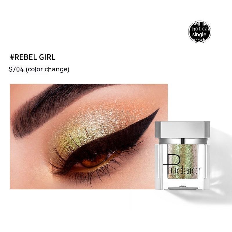 Eyeshadow with gold and green color change effect and Pudaier product packaging.