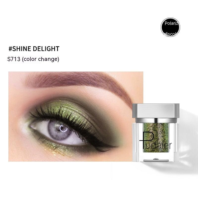 Eye makeup with green color change effect and Pudater product on a white background