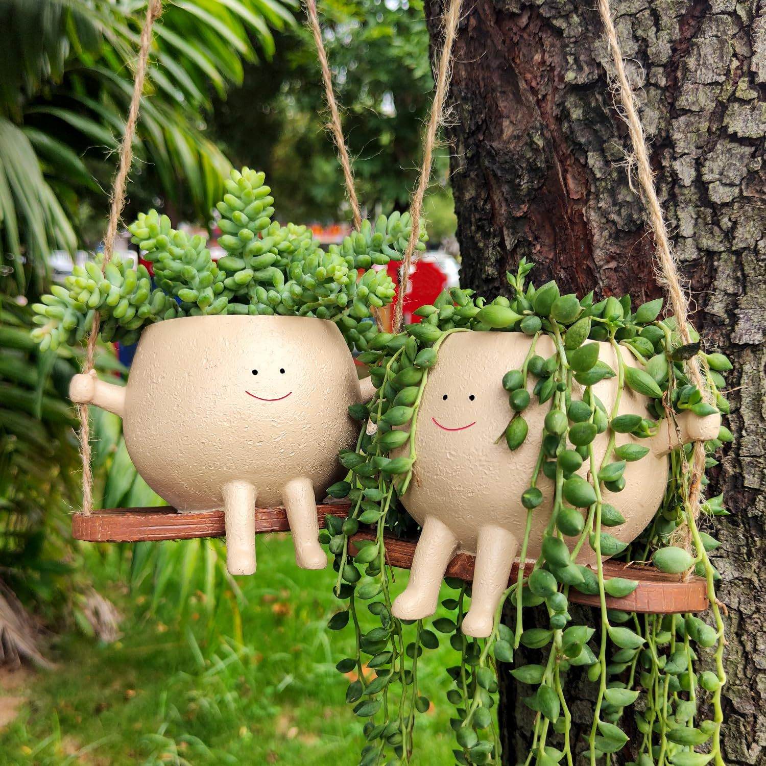 Durable resin plant hanger basket shaped like a smiling child’s face for indoor and outdoor garden decor