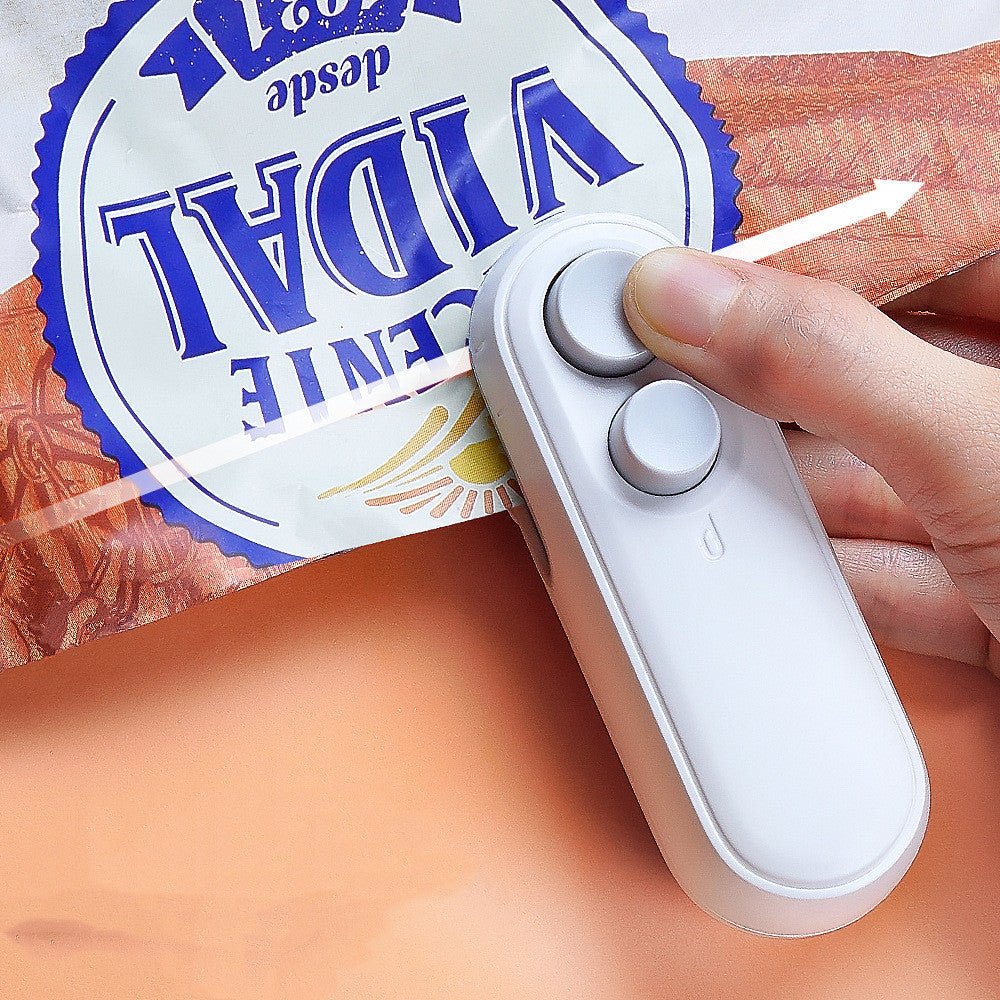Portable USB rechargeable bag sealer in compact white design sealing a snack bag to keep food fresh longer