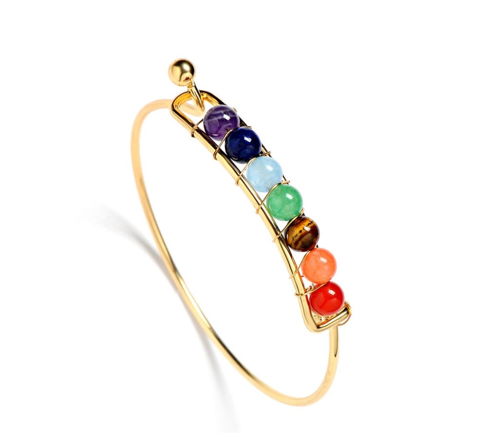 Yoga meditation bracelet featuring seven chakra stones and copper plating
