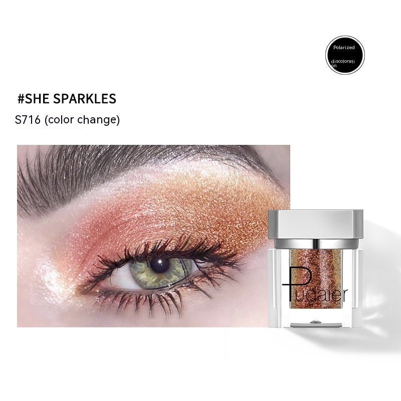 Eyeshadow with color change effect and product packaging on a white background